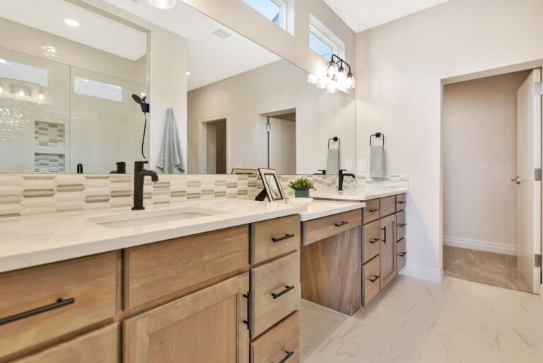 A view of the mirror and drawers in a PGH master bathroom