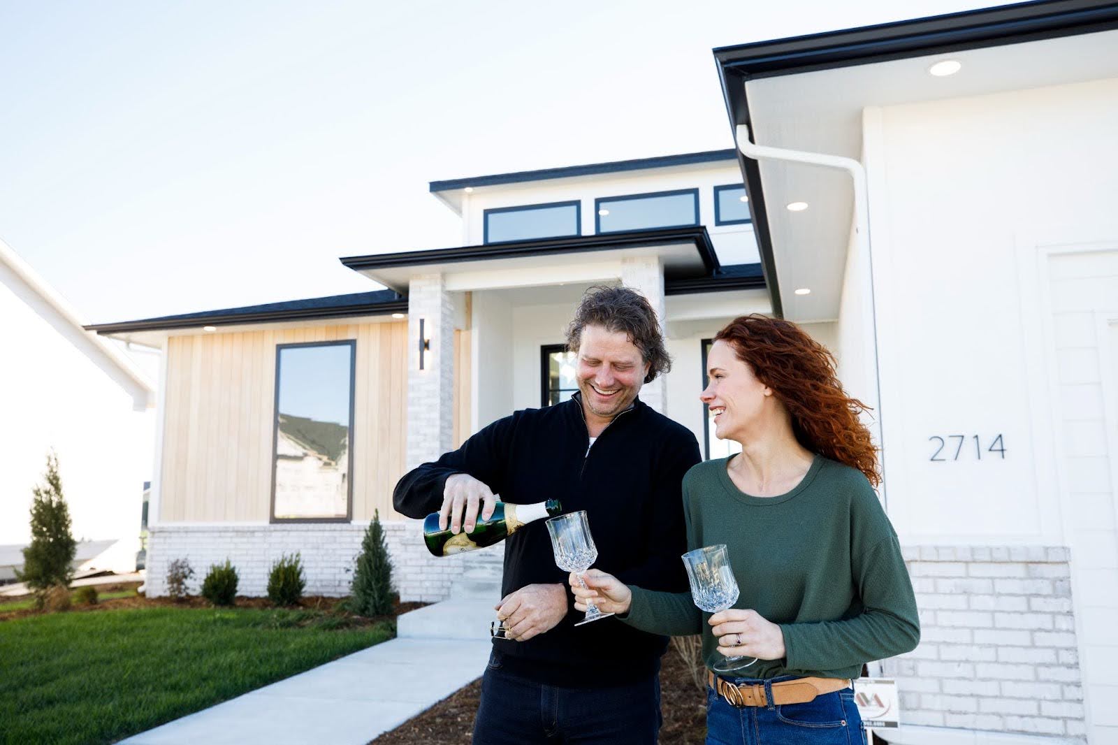 A couple celebrating their new custom luxury home in Wichita, KS